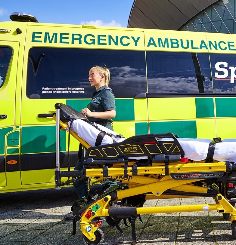 Ambulance workers conducting a clinical handover